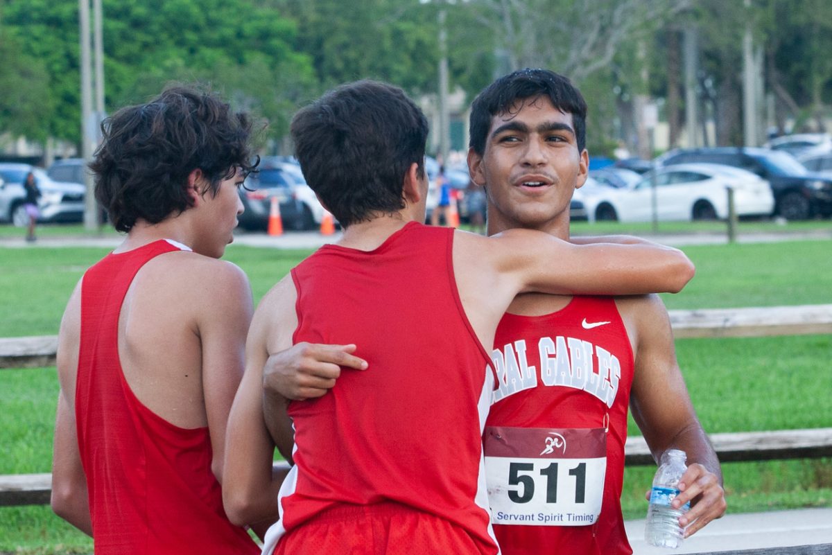 Embracing his teammate, Kamal retells his race, in full detail. 