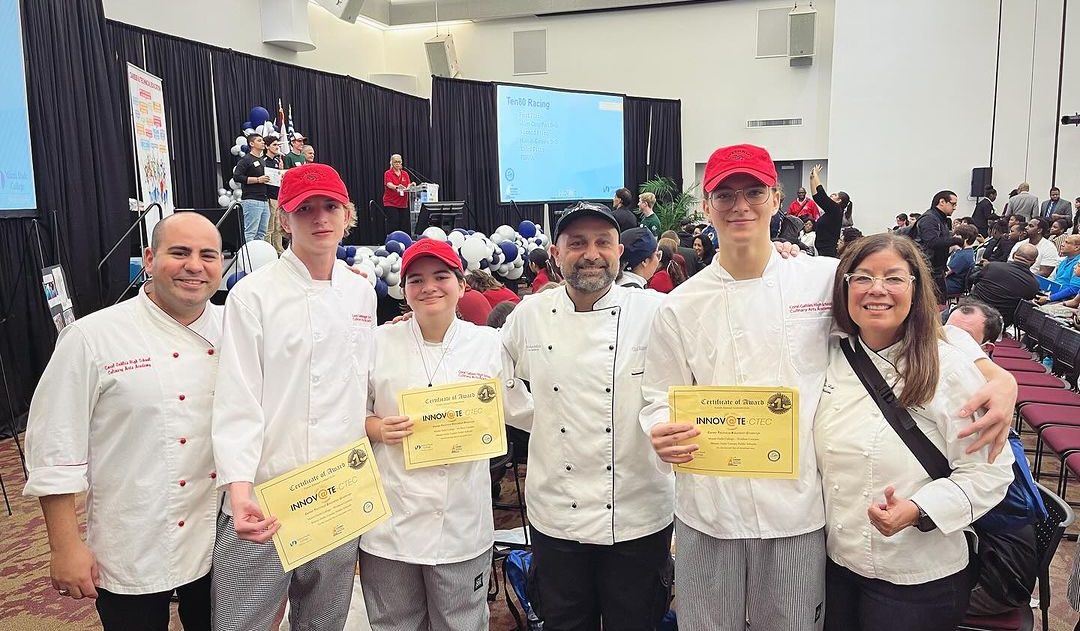 The winning Cavaliers pose with their teachers and certificates, rewarded for their creativity during the contest with first place.