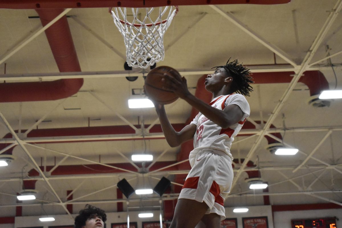 Underneath the hoop, a player fights for a point against the Carol City Chiefs.