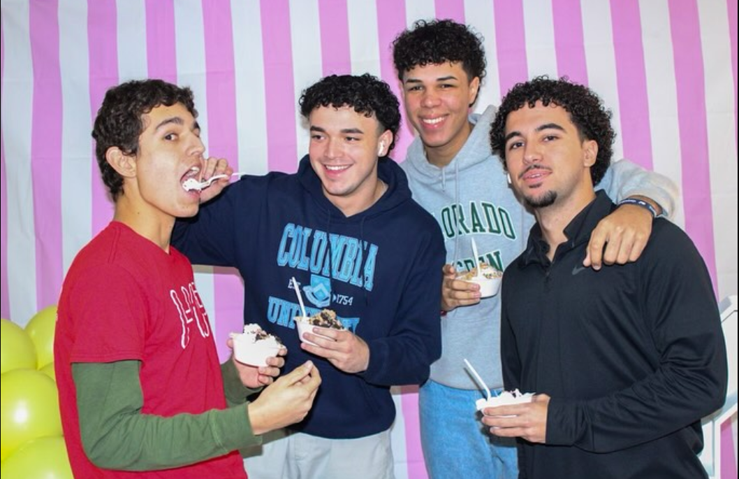 With their friends by their sides and ice creams in hand, Cavalier seniors pose at the photo booth in the decorative auditorium lobby. 