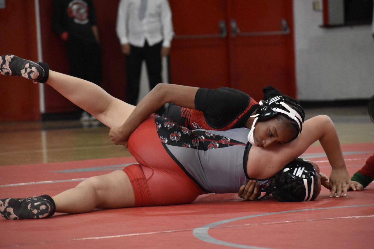 Setting up the perfect scenario to pin her opponent, Willis attempts a claw up followed by a knee bend. These wrestling moves help her triumph in the first wrestling scrimmage of the 2023-2024 season.