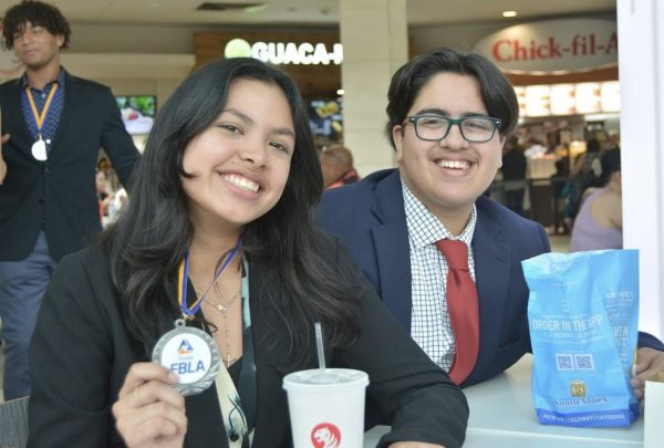 Lucas Martinez and Lorena Arayo have a celebratory lunch at Dadeland Mall after securing awards. 