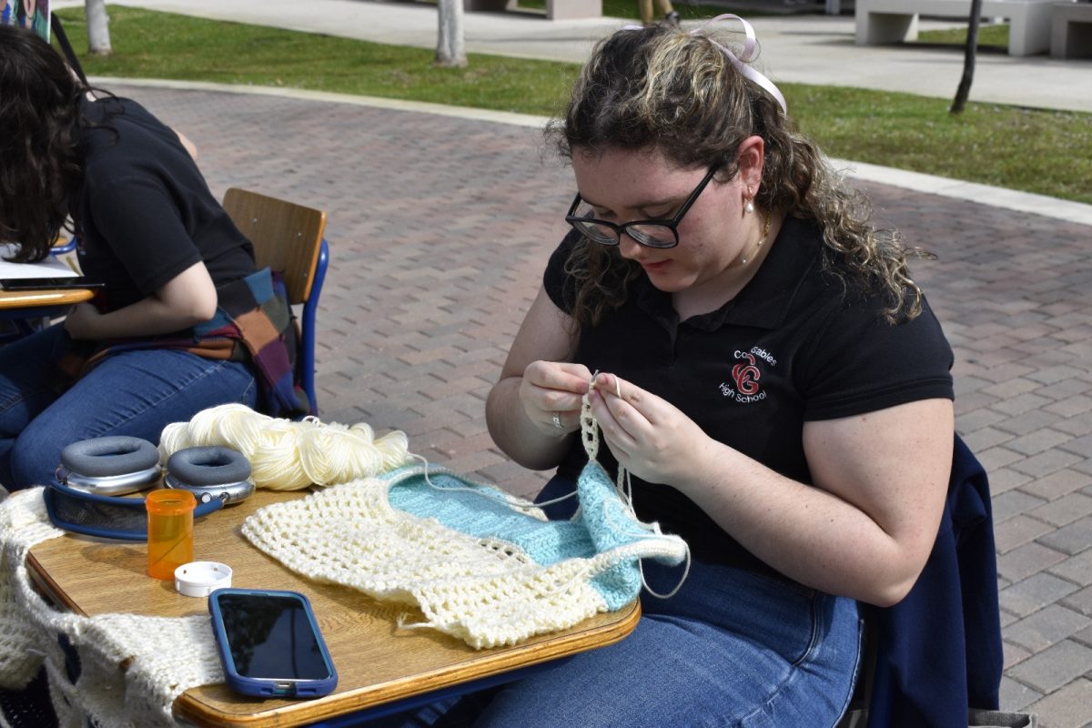 Hernandez worked on her crocheted top during Art Walk.