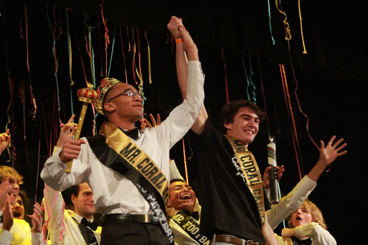 Announced by Gables alum and previous Mr. Coral Gables, Marcos Algeciras, Jamar *last name* is called to celebrate his victory as this years Mr. Coral Gables.