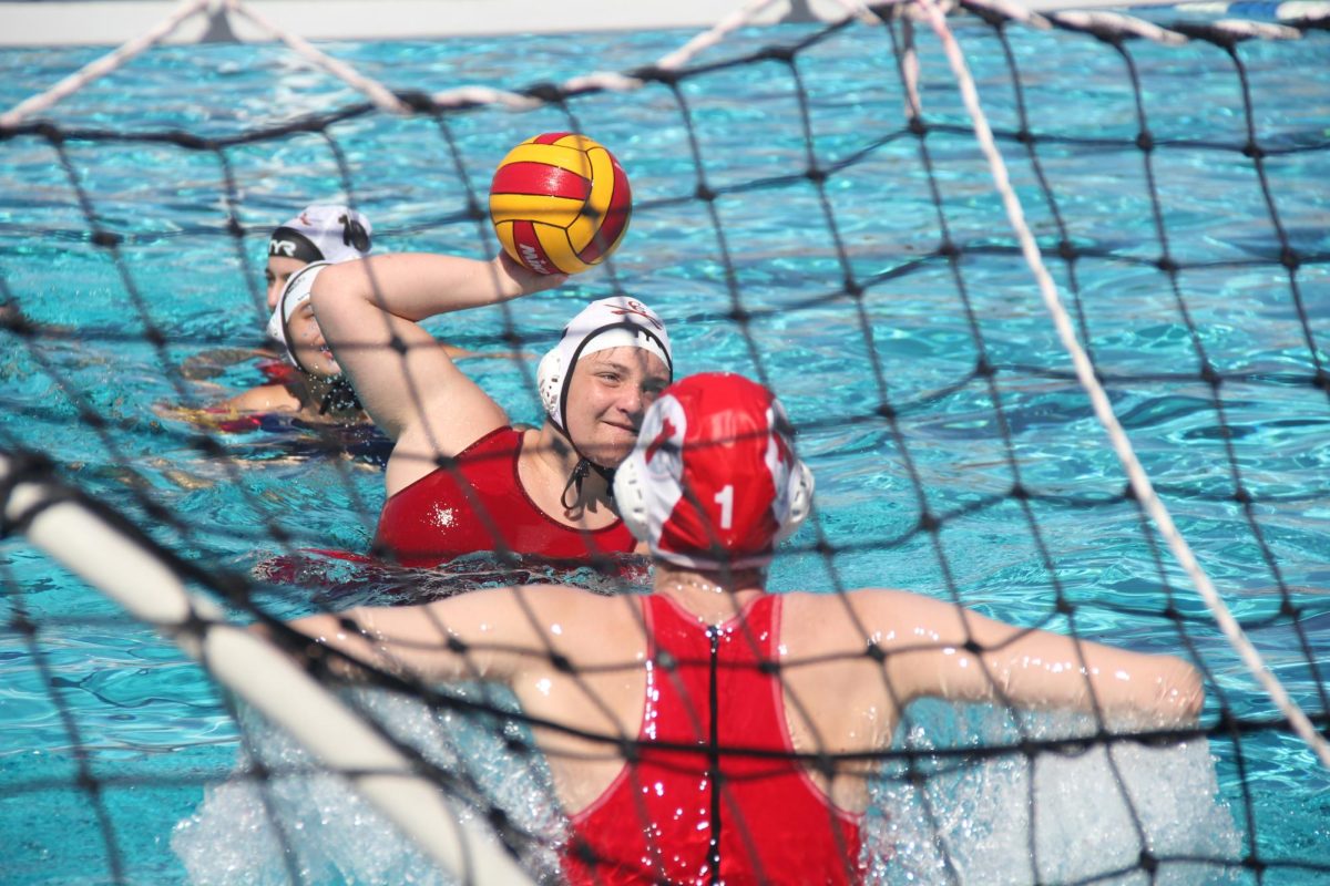  A Cavalier develops overhead hand placement before launching the ball between the goal posts. 