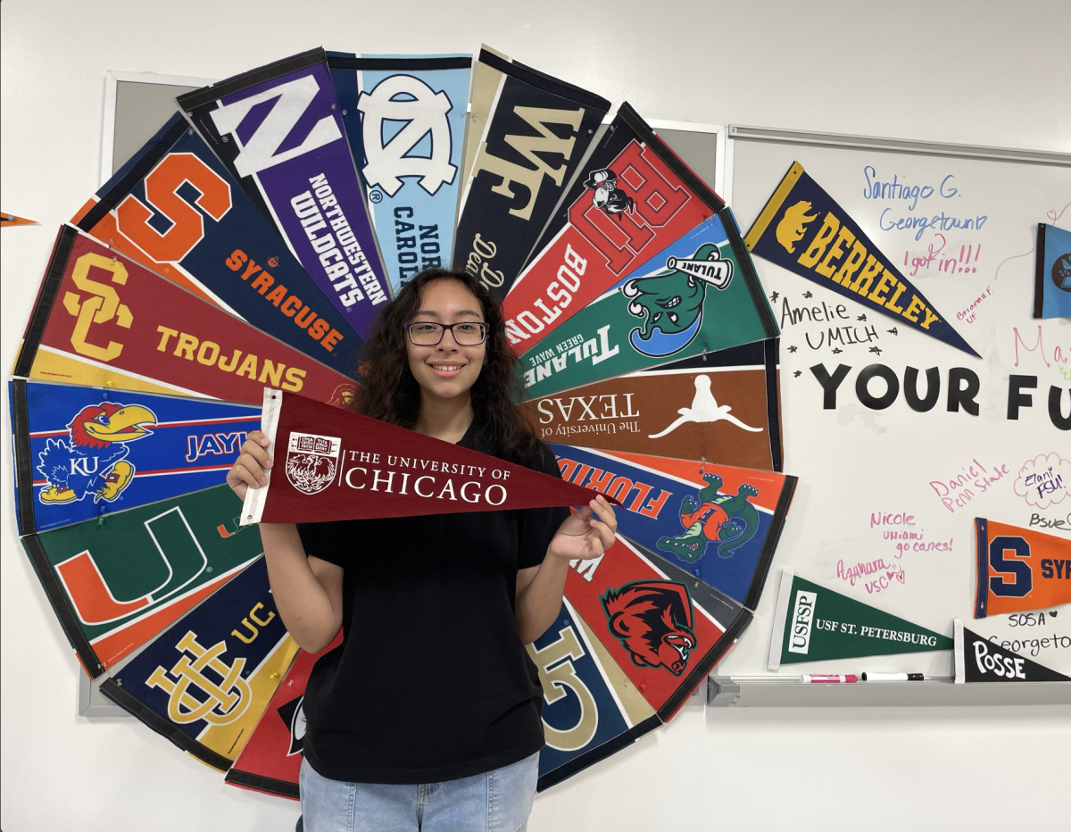 Maria Rivero stands proudly showing her new school the University of Chicago.