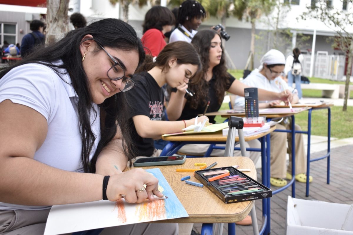 Sophomore Leandra Ayala volunteered to practice her newfound passion of drawing and create a masterpiece next to her friends. 