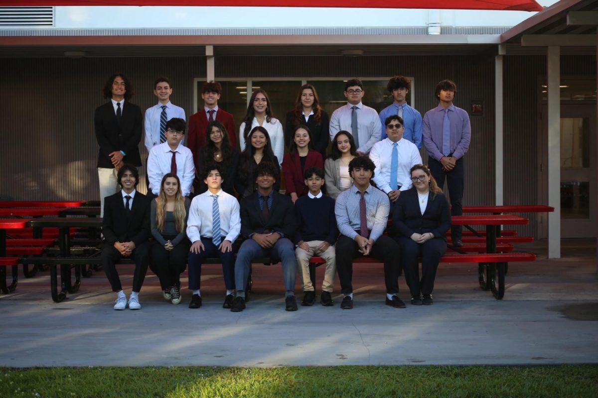 The 21 FBLA board members take a picture for the 2024-2025 year while reminiscing about their past competitions and experiences.