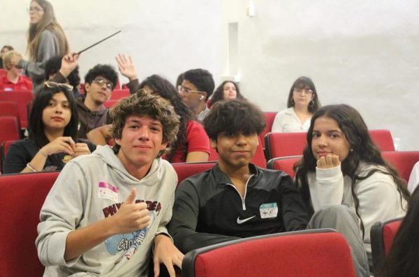 Ready to take on the two days of preparation for the IB program, sophomores sit together in the auditorium. They are taught about the various components of IB with activities incorporated throughout the two days.