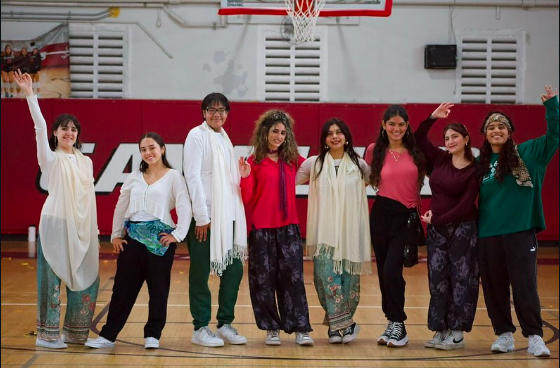 The Bhangra team posing after their impressive performance in front of their classmates. With an unexpected but fun dance, the team left with smiles on their faces.