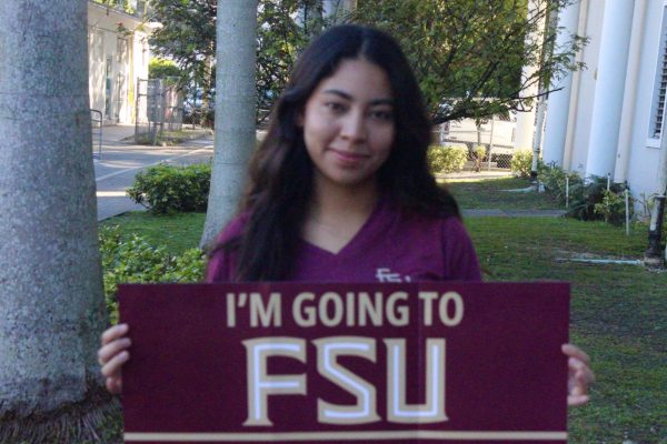 Florida State University incoming freshman, Angelee Ortiz, proudly waves the colleges' banner that foresees her future.