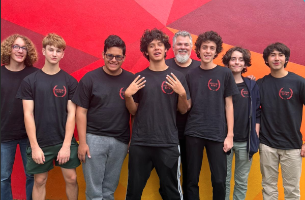 The Varsity team poses with Mr. Miller after their first history bowl competition. Their score advanced them to regional competitions, where they qualified for nationals. 