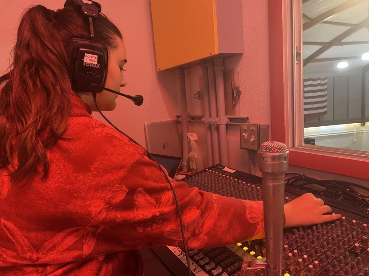 During first lunch, Lara spends her time in the auditorium fixing all the sound malfunctions, further preparing it for the next event.