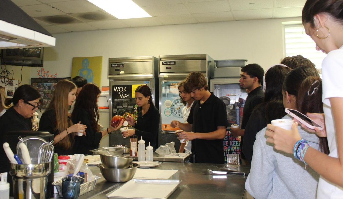 In culinary, students begin their cooking process, able to do so through paying the class fees.