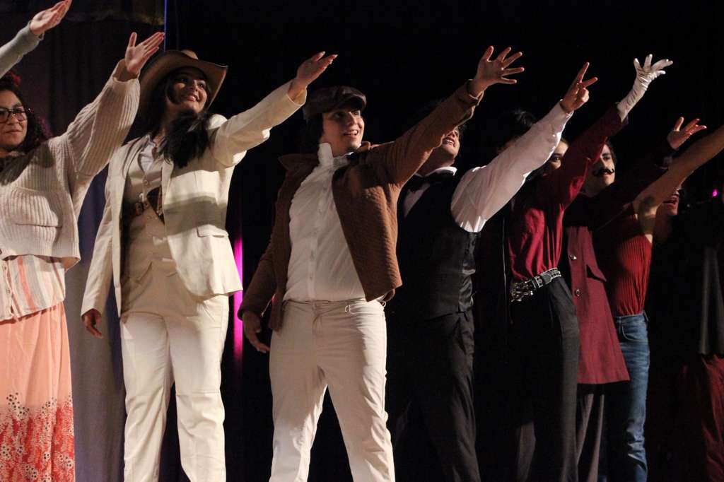 During their final bow, the Troupe cast honors the Audio/Visual team who assisted in them with the technology aspect of their auditorium performance.