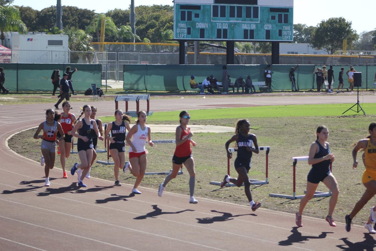 Senior Lauren Puig opens her stride attempting to catch the pack of runners in front of her.