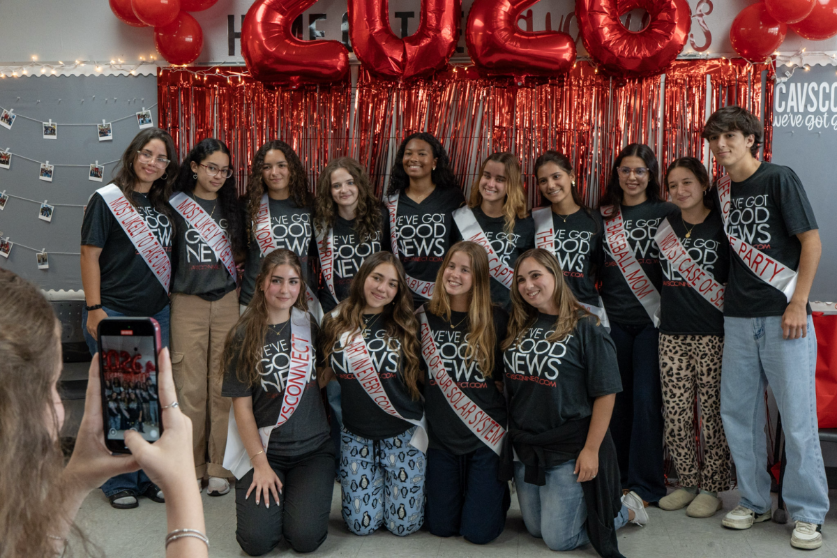 CavsConnect seniors share a final class photo with Ms. Passwaters, cementing their legacy as they join CavsConnect alumni.